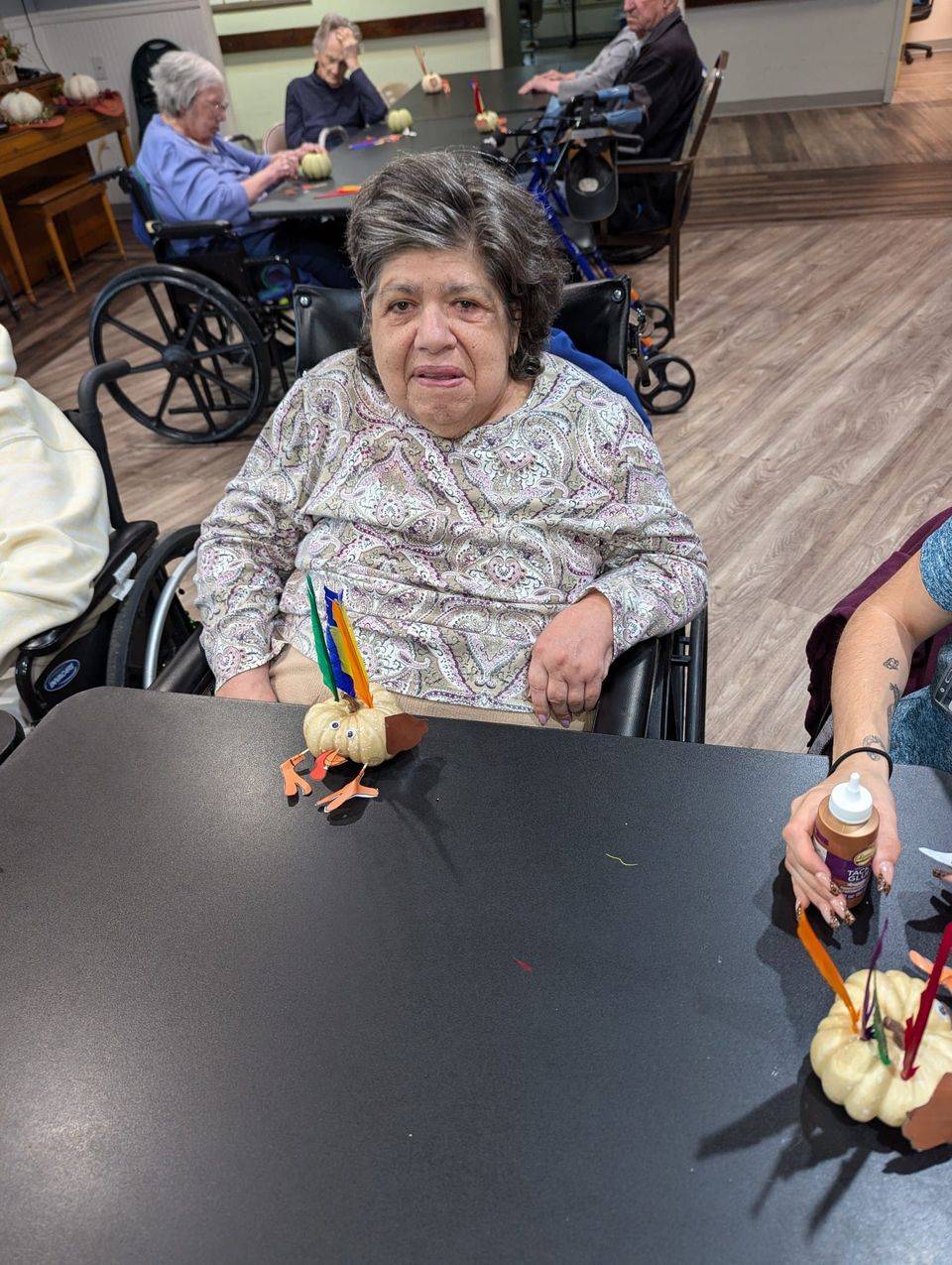 resident at alhambra enjoying thanksgiving turkey crafts with friends